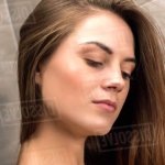 Naked girl with long hair in the shower cabin